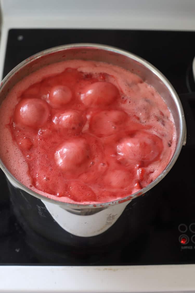 Pot of strawberry jam on stove