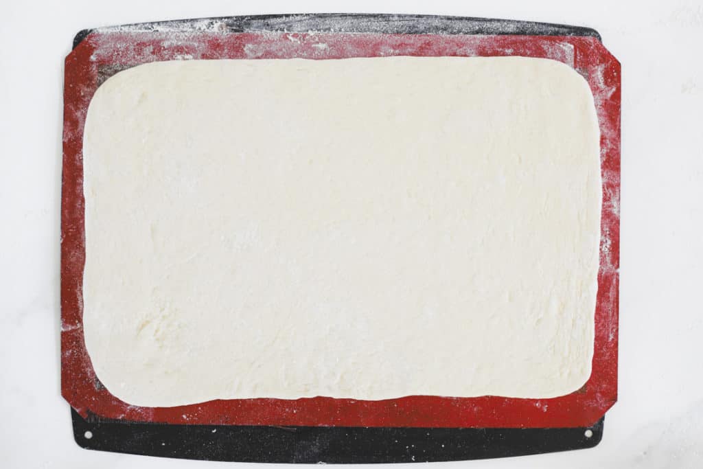 Rectangle of rolled pizza dough for stromboli
