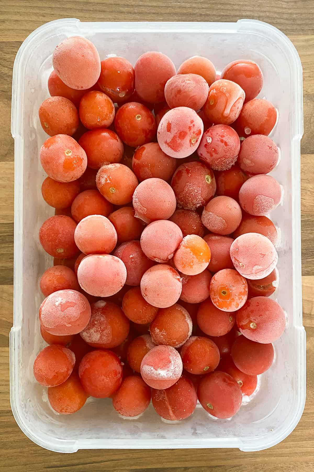 Container of frozen cherry tomatoes