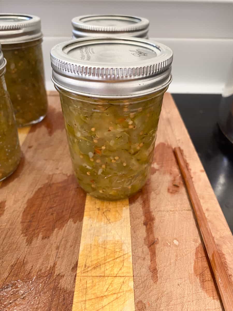 Jar of relish on a wooden board